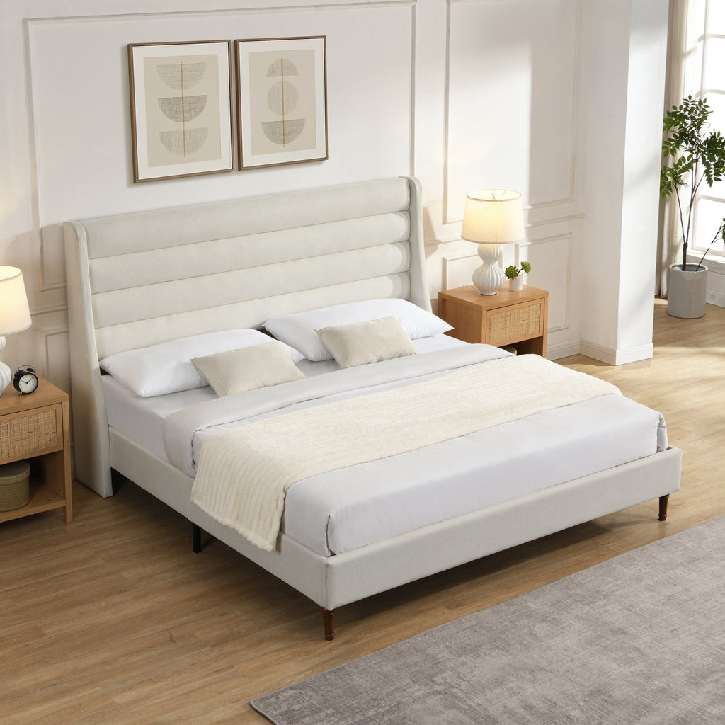 Upholstered bed frame with wave headboard from Anthony & Home's Exclusive Collection, showcasing plush fabric and modern design.