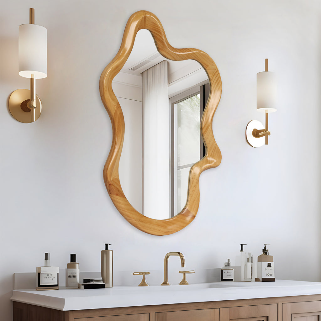 Wall mirror with natural wood frame and irregular silhouette by Anthony & Home, showcasing a stylish, organic design element.