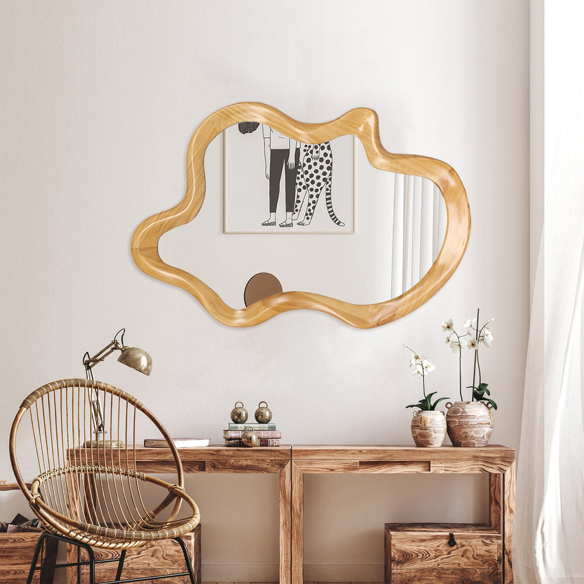 Wall mirror with an irregular silhouette in natural wood frame by Anthony & Home, showcasing a modern, organic design.
