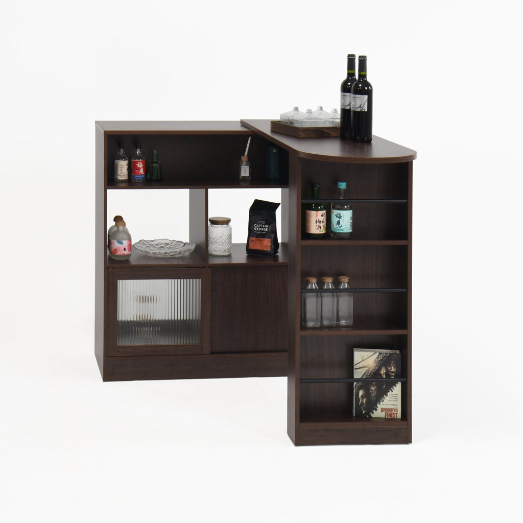 Walnut bar cabinet with rotating top, six storage compartments, and ribbed glass doors from Anthony & Home's Atelier Collection.