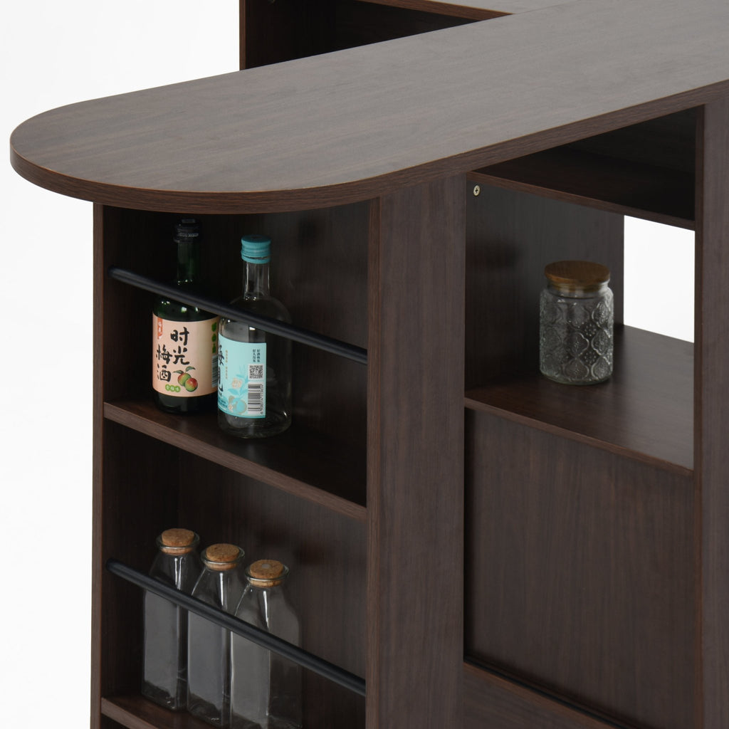 Walnut bar cabinet with rotating top, six storage compartments, and ribbed glass doors from Anthony & Home's Atelier Collection.
