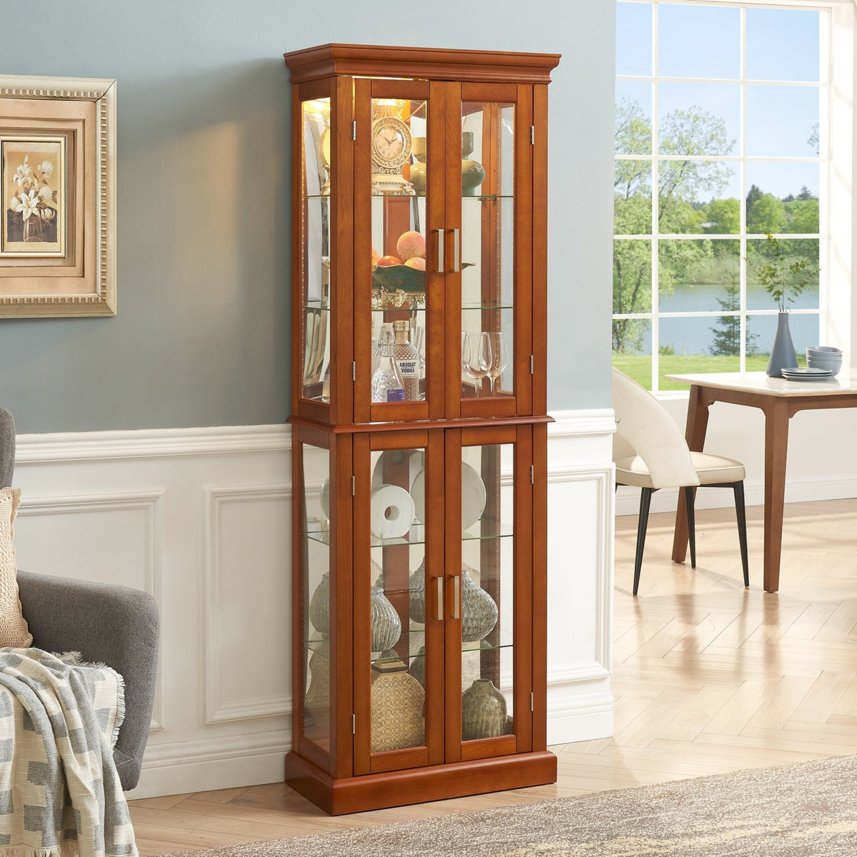 Walnut finish lighted curio cabinet with mirrored back, showcasing glass display shelves and elegant wood details.