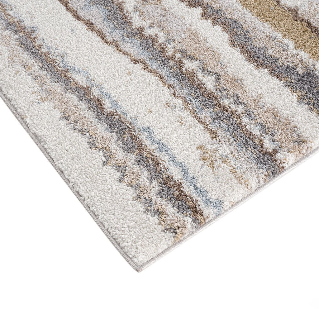 Watercolor stripe woven area rug by Anthony & Home featuring vibrant Turkish-inspired watercolor stripe design.