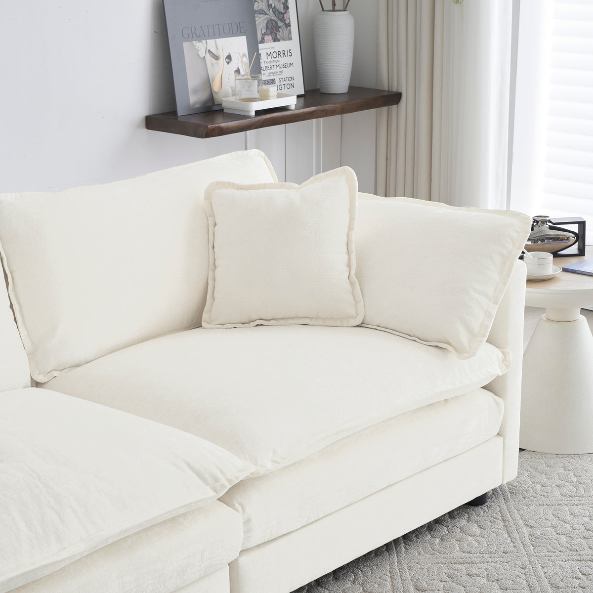 White chenille Luxe modular L-shaped sectional sofa with reversible ottoman by Anthony & Home, showcasing comfortable seating and modern design.