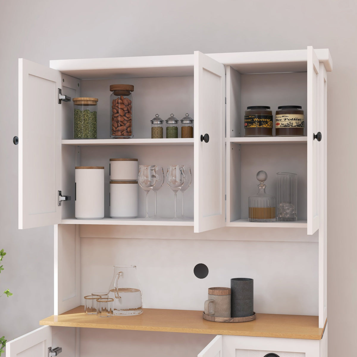 White freestanding kitchen pantry hutch from Anthony & Home with shelves, cabinets, and drawers for kitchen storage.