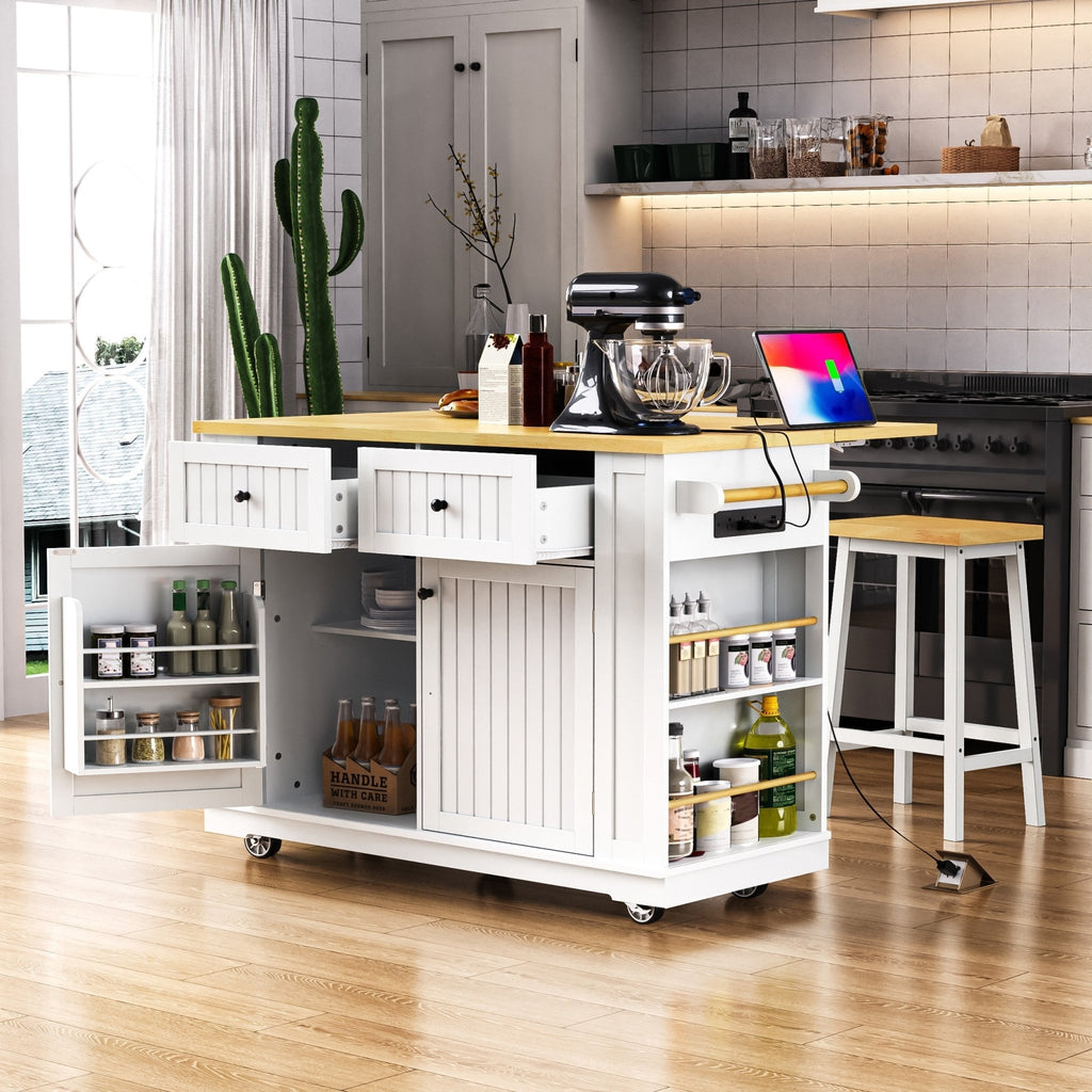 White kitchen island from the Atelier Collection by Anthony & Home, featuring a spacious surface and storage drawers.