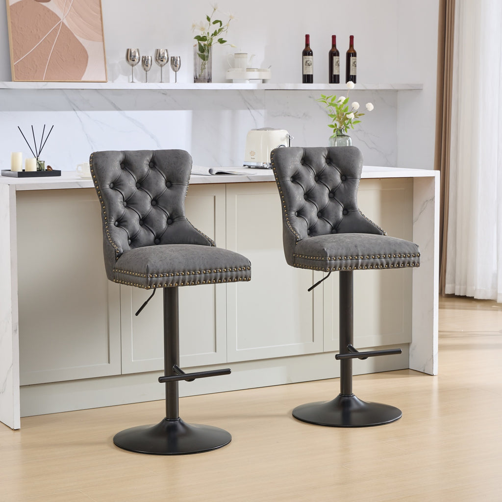 Set of two Anthony & Home tufted PU leather bar stools with adjustable height, modern design, and wooden legs for kitchen or bar area.