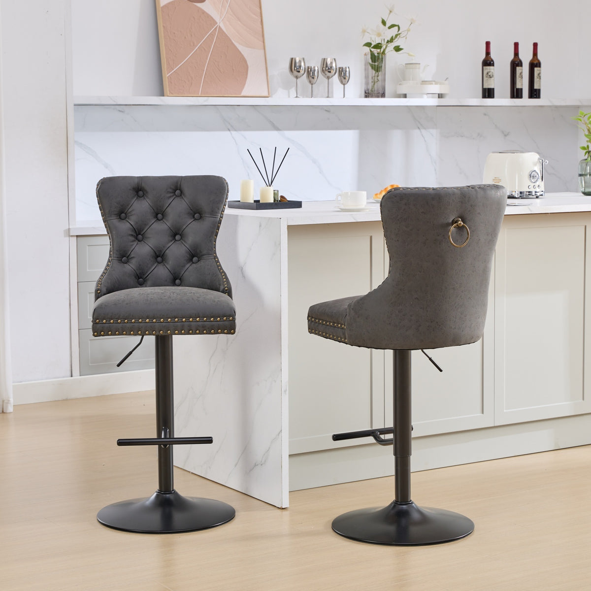 Pair of Anthony & Home tufted PU leather bar stools with adjustable heights, sleek design, and modern style for kitchen or bar area.
