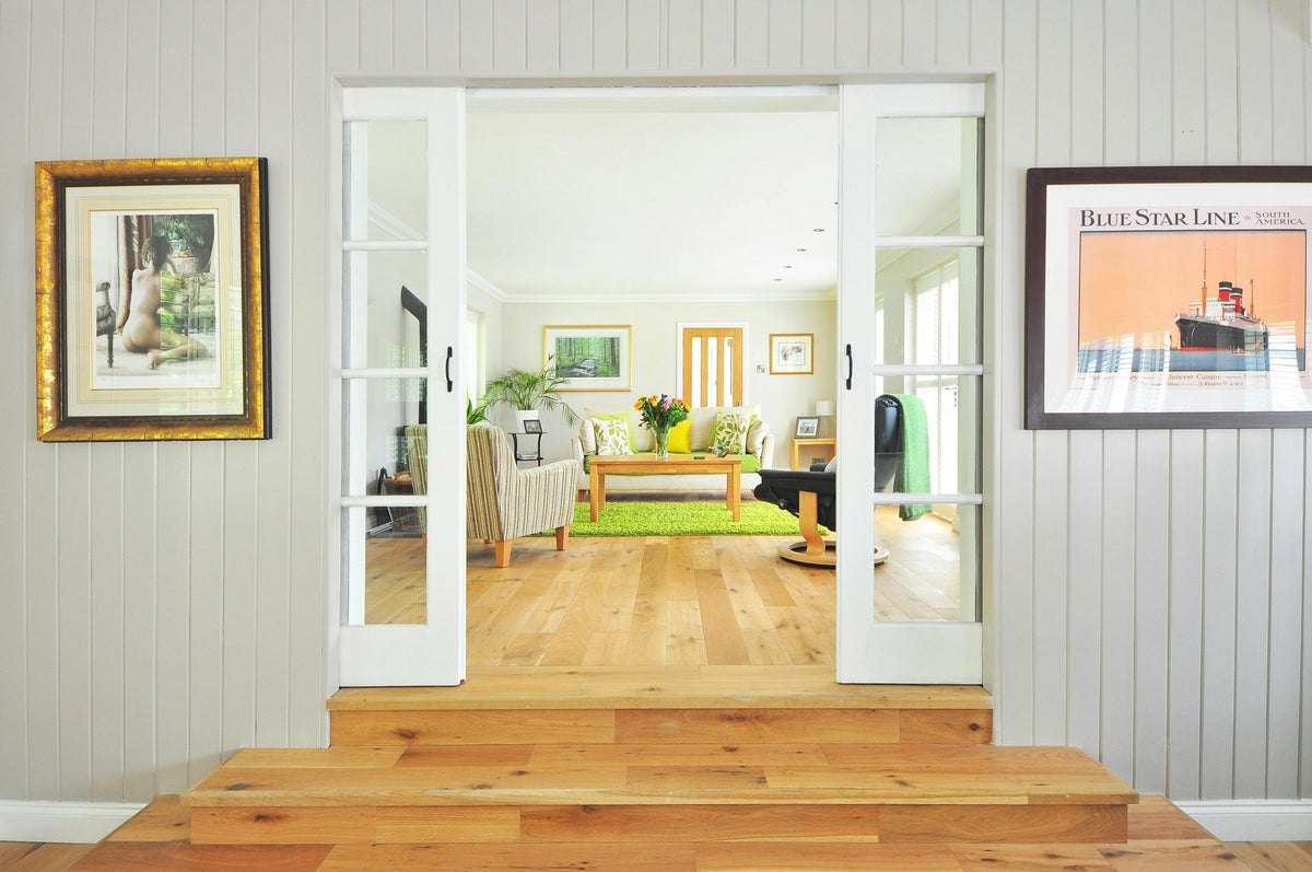 Interior view of a spacious 3-bedroom, 2-bath home plan by Anthony & Home Residential Designs, showcasing living room and kitchen.