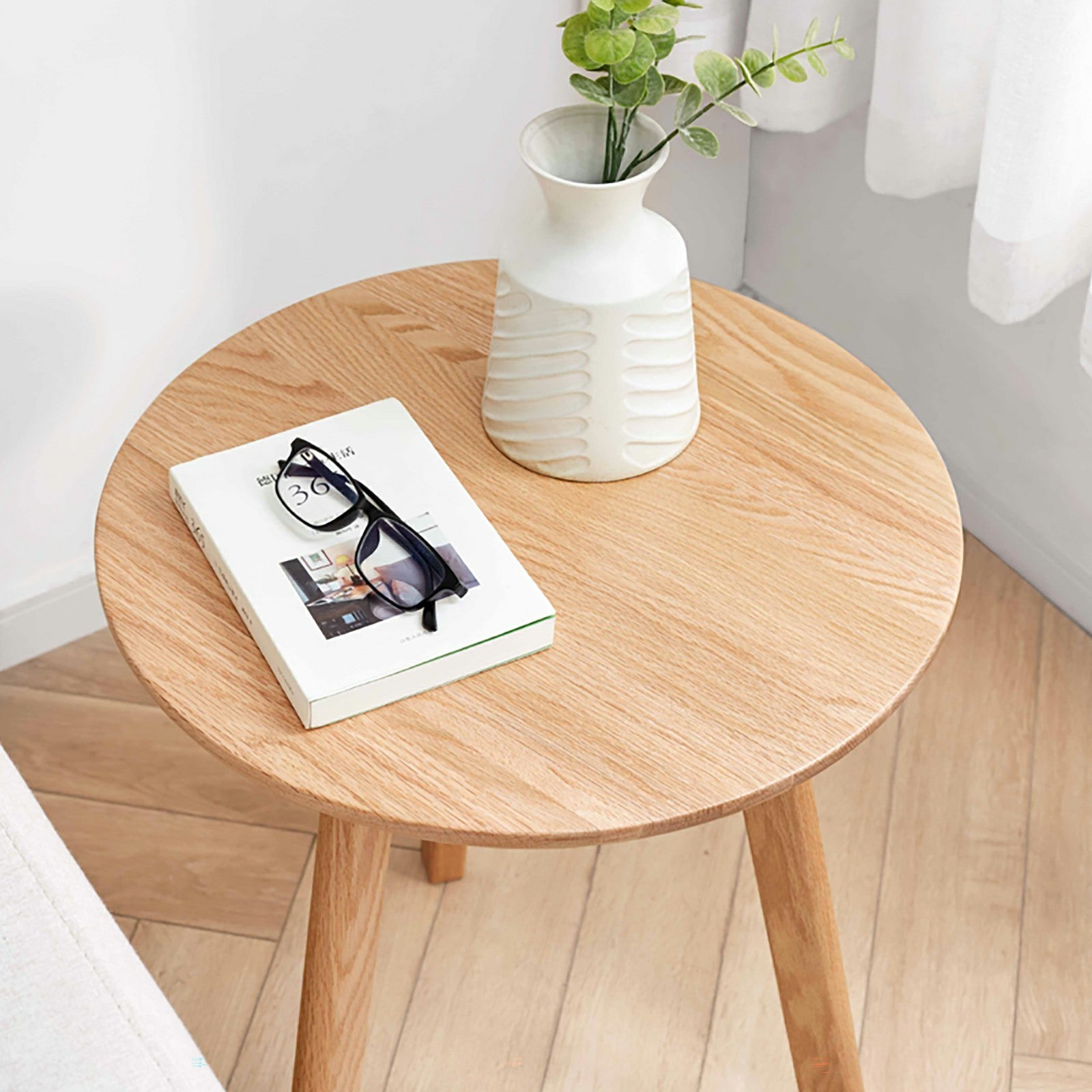 Solid oak round end table from Anthony & Home's Signature Collection, featuring a smooth wood finish and sturdy design.