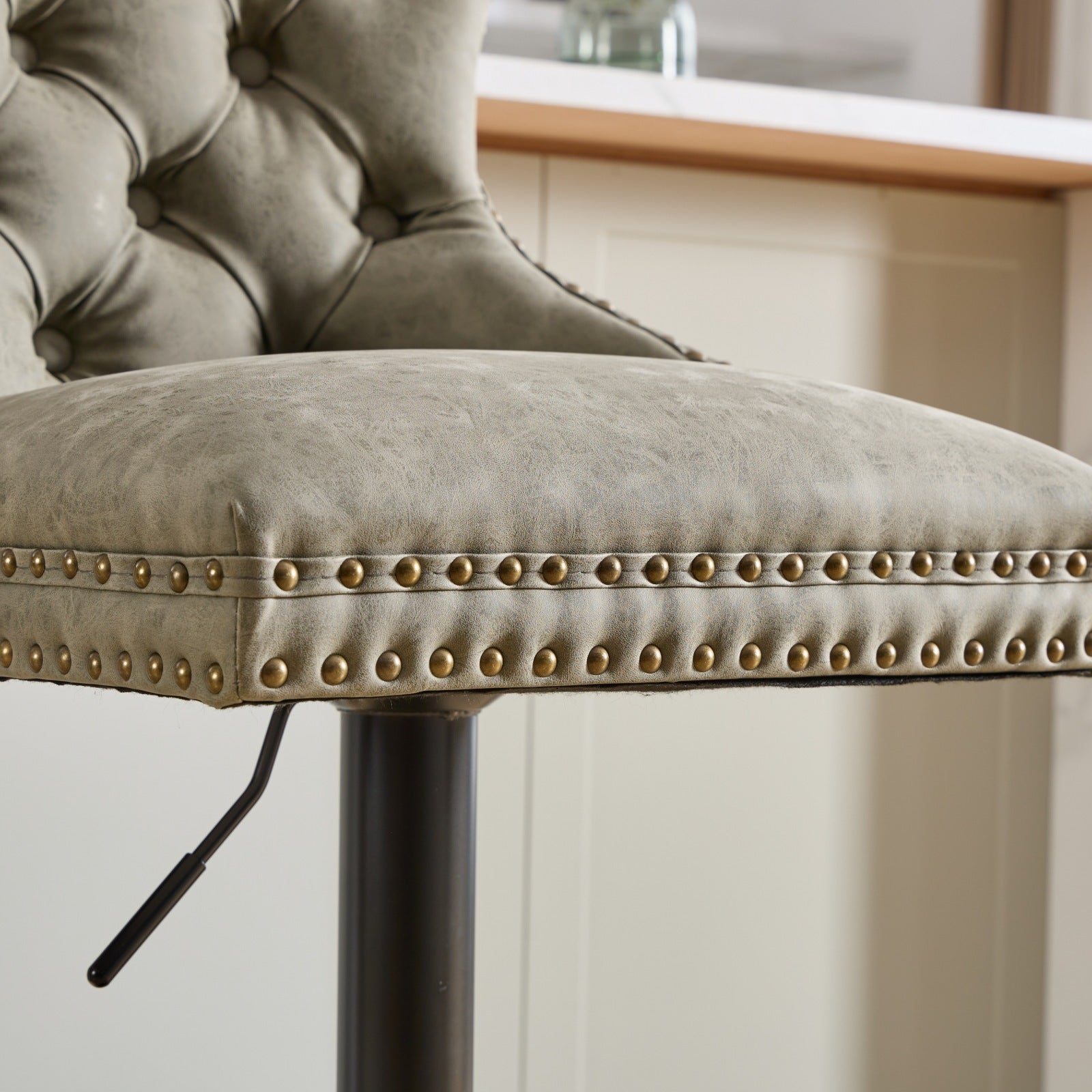 Pair of aged retro PU leather bar stools from Anthony & Home, featuring vintage-style design and sturdy metal legs.