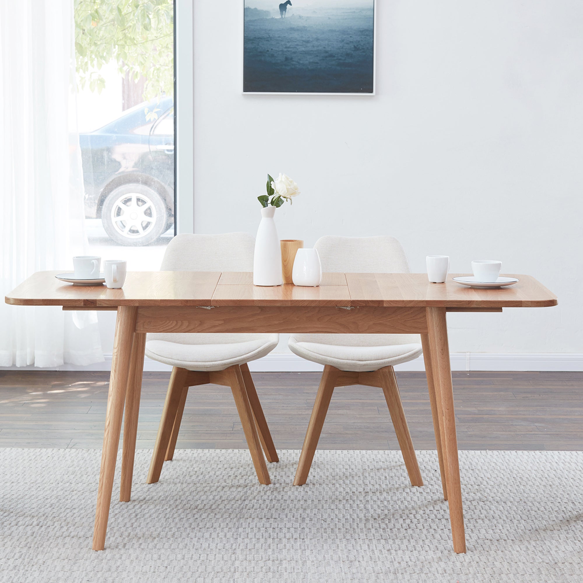 Solid oak extendable dining table by Anthony & Home, showcasing its natural wood finish and sleek modern design.