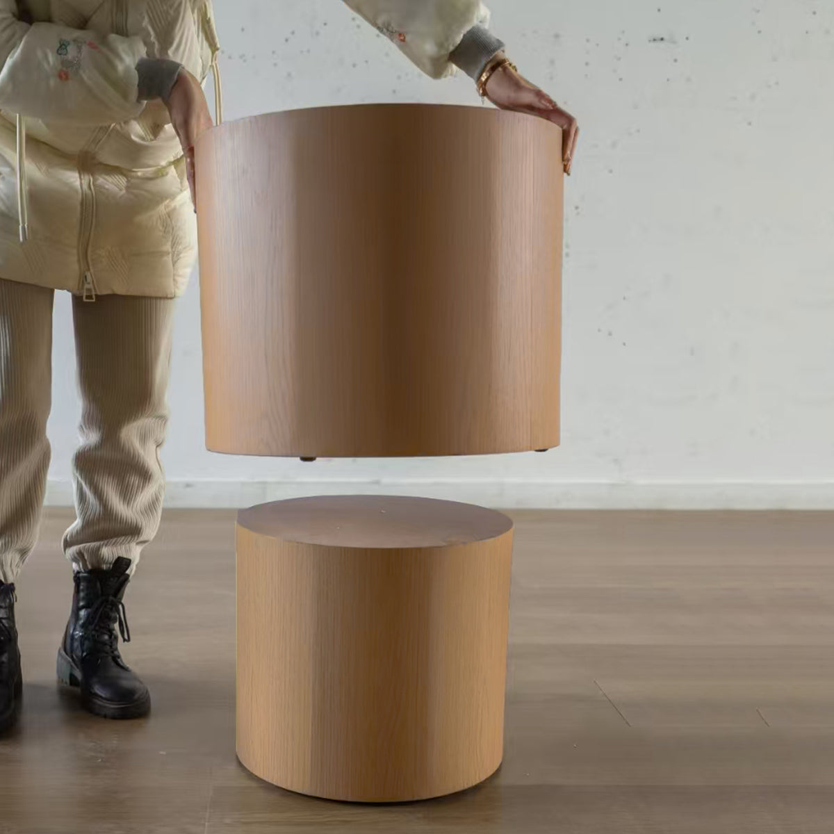 Pair of nesting round coffee tables in wood with black metal legs from Anthony & Home's Atelier collection.