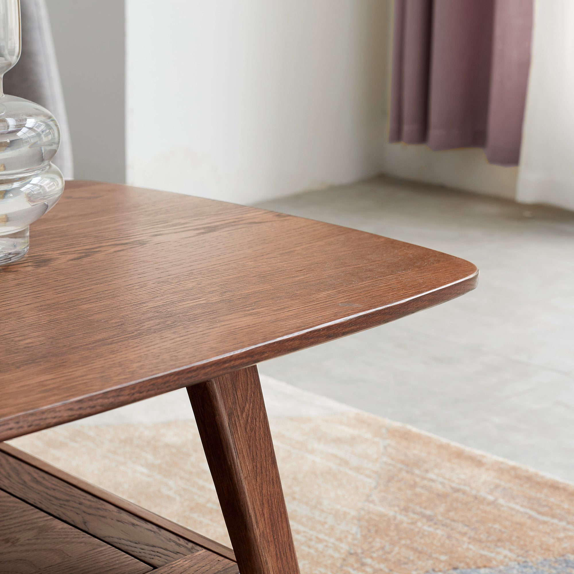 Walnut finish solid oak coffee table with built-in storage from Anthony & Home, showcasing a sturdy design and modern style.