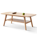 Natural oak coffee table with storage shelf from Anthony & Home's Atelier Collection, showcasing a sleek, timeless design.