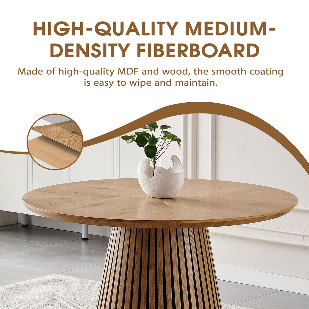 Round solid wood dining table from Anthony & Home's Atelier Collection, showcasing a smooth, polished surface and sturdy wooden legs.