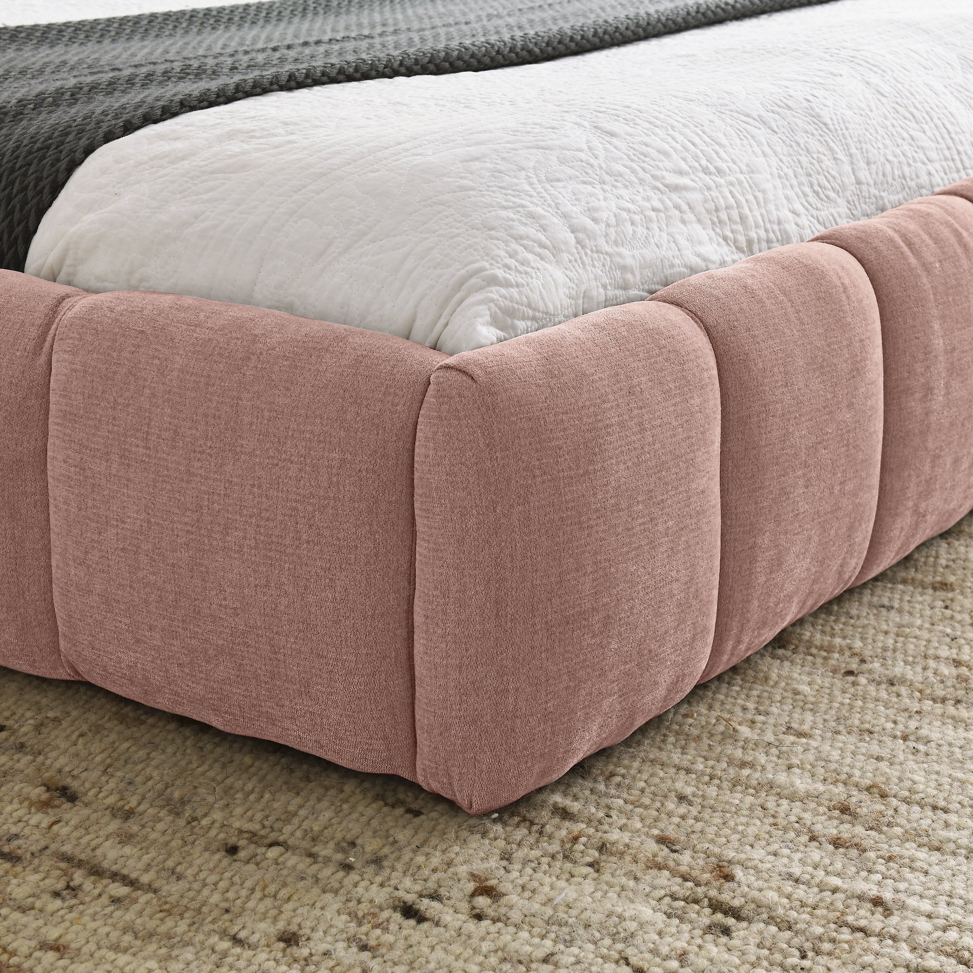Pink upholstered queen bed frame from Anthony & Home's Limited Chenille Collection, no box spring needed, showcasing plush fabric and elegant design.