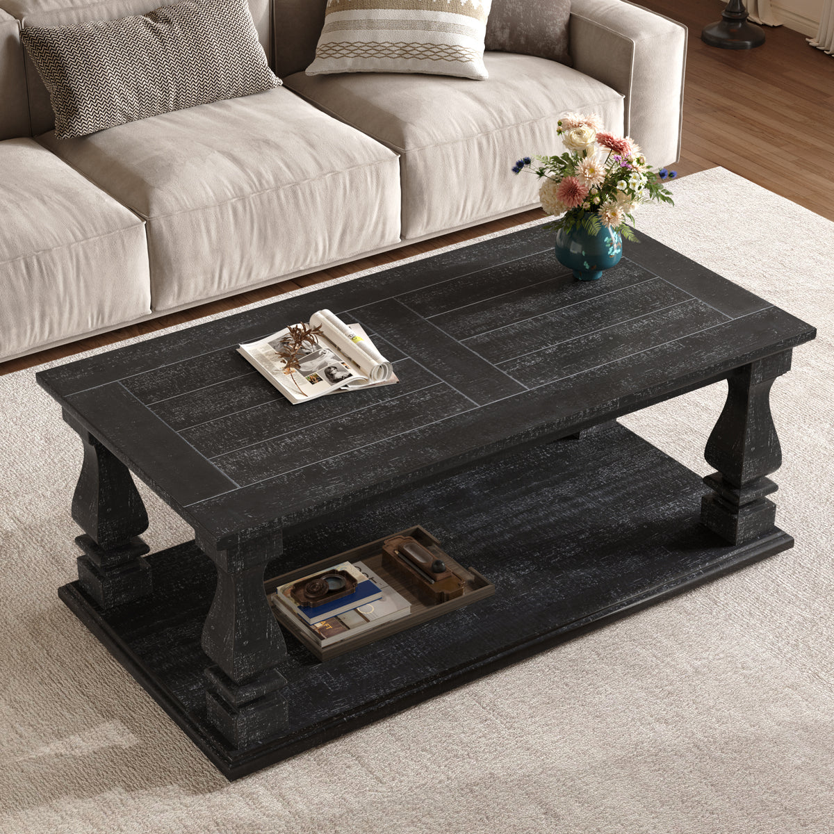 Weathered black farmhouse coffee table with heavy plank top, baluster legs, and storage shelf from Anthony & Home Atelier Collection