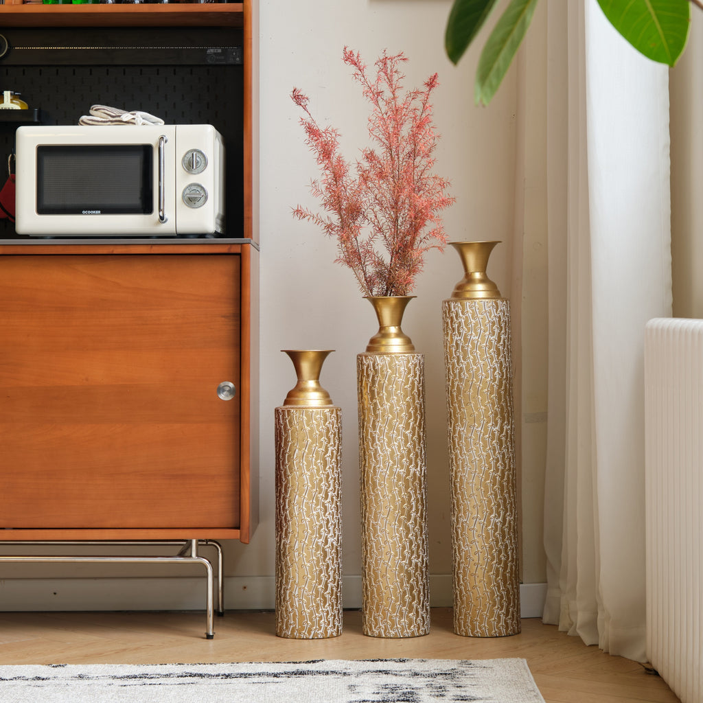 Set of three Heritage Collection gold distressed metal vases with vine pattern, ideal for living room decor by Anthony & Home