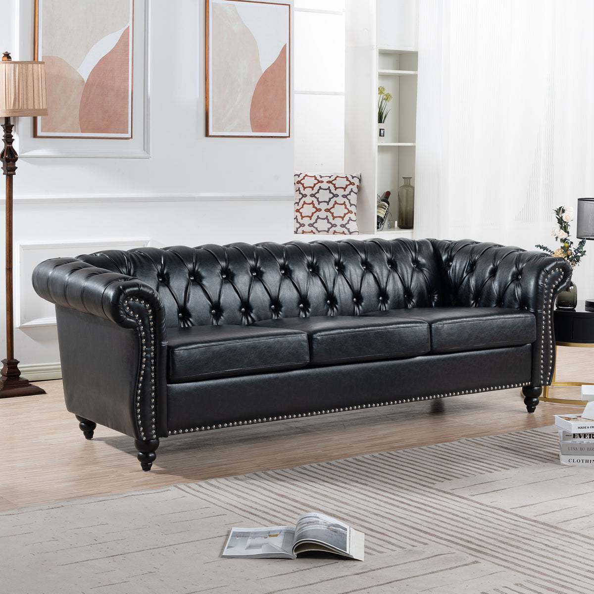 Anthony & Home Chesterfield rolled-arm three-seater sofa with plush upholstery and classic design, shown in a cozy living room setting.