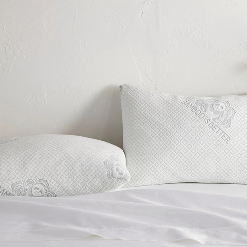 Pair of adjustable bamboo cooling pillows by Bamboo is Better on a white bed, showcasing breathable bamboo fabric and ergonomic design.