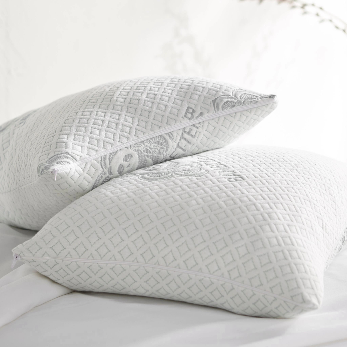 Pair of adjustable bamboo cooling pillows from Bamboo is Better, queen size, white, with breathable, ergonomic design for restful sleep.