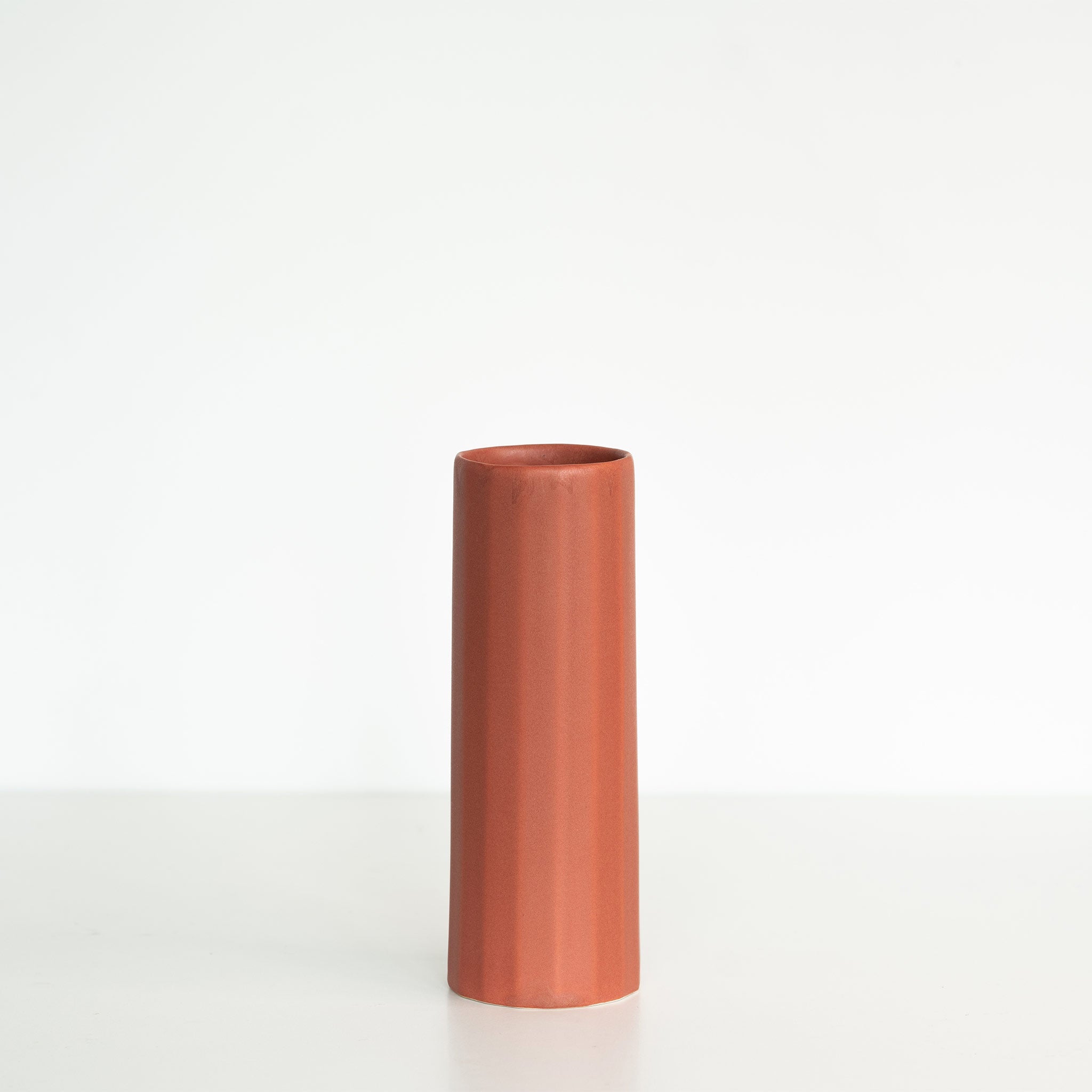 Handmade terracotta red porcelain Bloom Vase by Ember Collective, a stylish flower vase with smooth, elegant design.