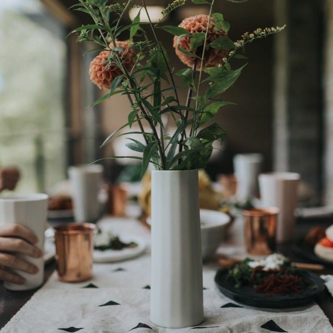 Handmade porcelain Bloom Vase by Ember Collective, showcasing a sleek, modern design perfect for floral arrangements.