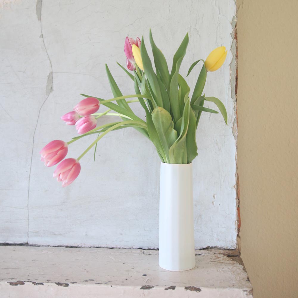 Handmade porcelain Bloom Vase by Ember Collective, showcasing a sleek, elegant flower vase with a bright, modern design.