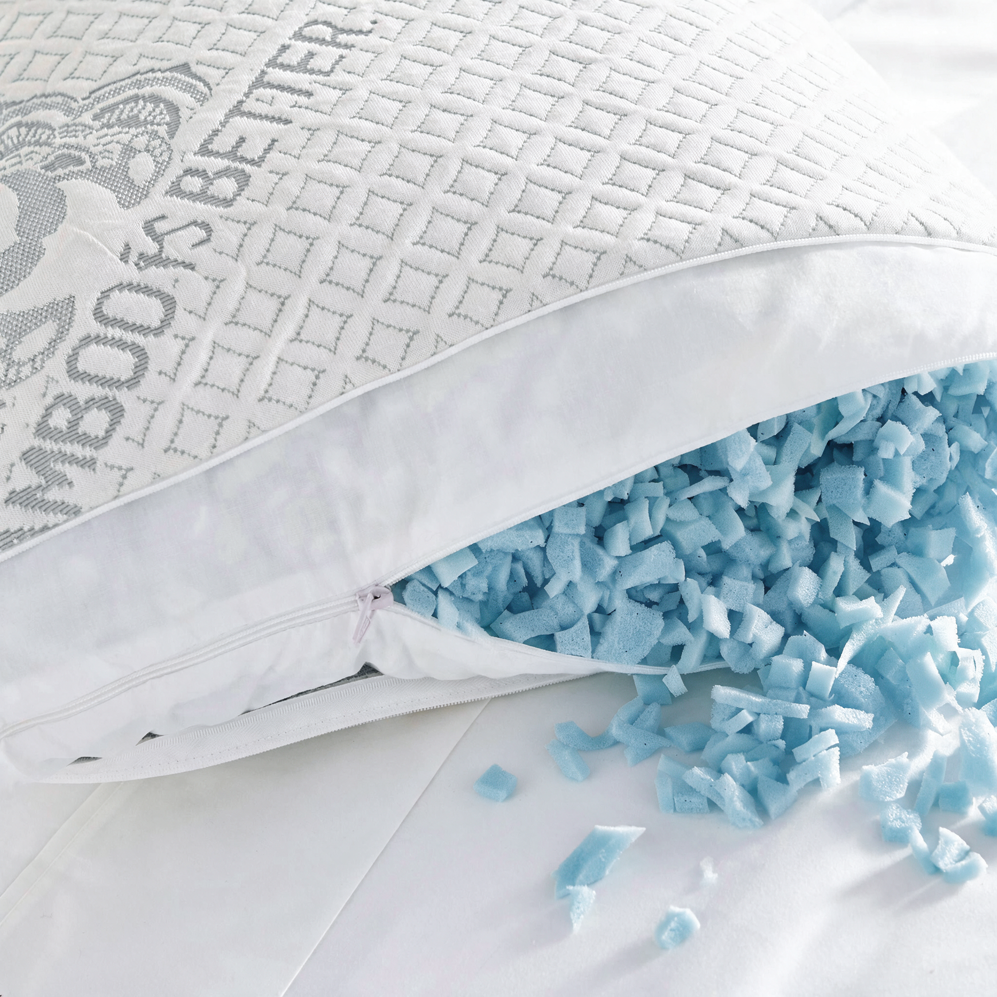 Adjustable Bamboo Cooling Pillow from Bamboo is Better with soft blue pillow stuffing shown in the image.