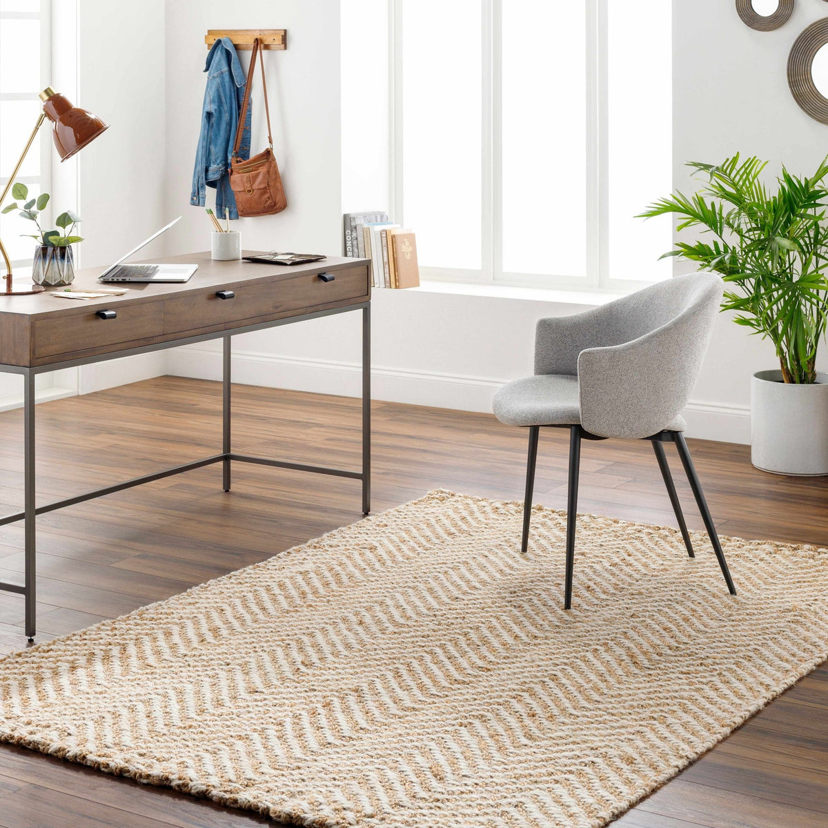 Hand-woven jute area rug by Boutique Rugs, exclusive edition, shown in a cozy room setting with natural fibers and textured surface.