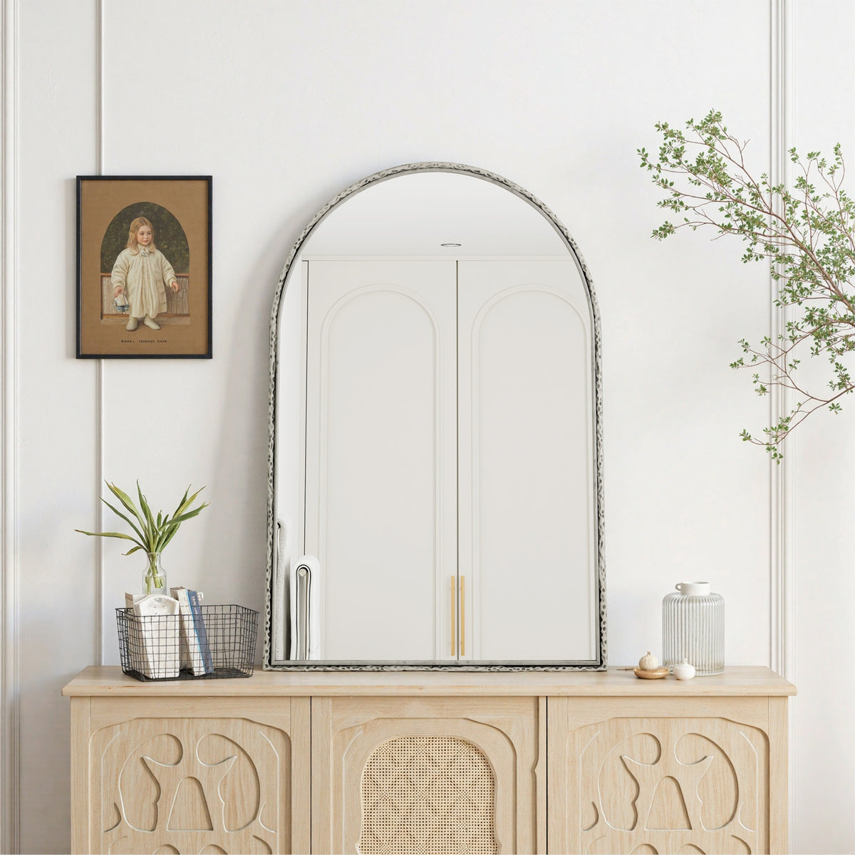Arched silver mirror with tempered glass frame from Anthony & Home, showcasing a sleek, reflective surface with a modern design.