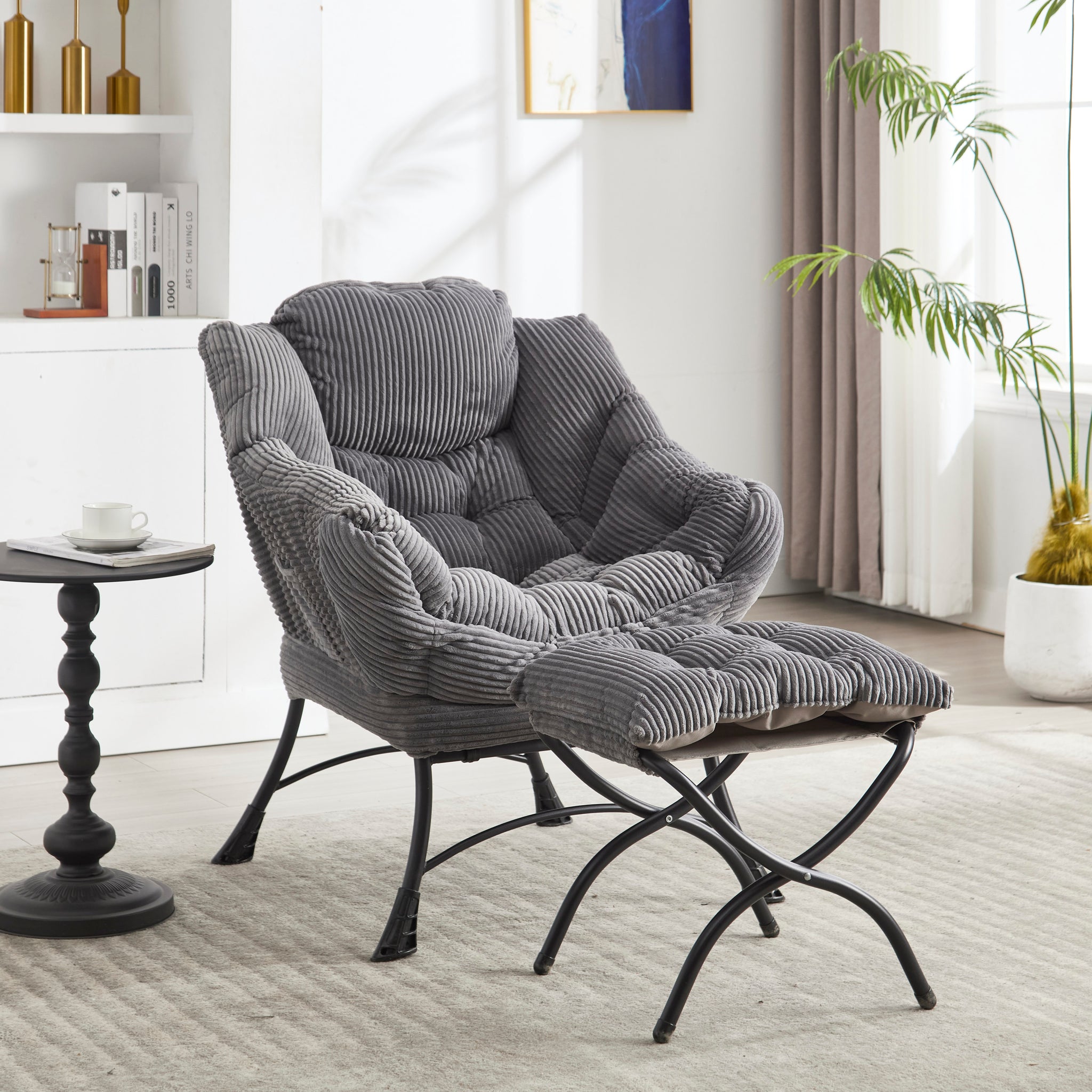 Grey upholstered lounge chair with matching ottoman and armrests from Anthony & Home, stylish and comfortable for living space.
