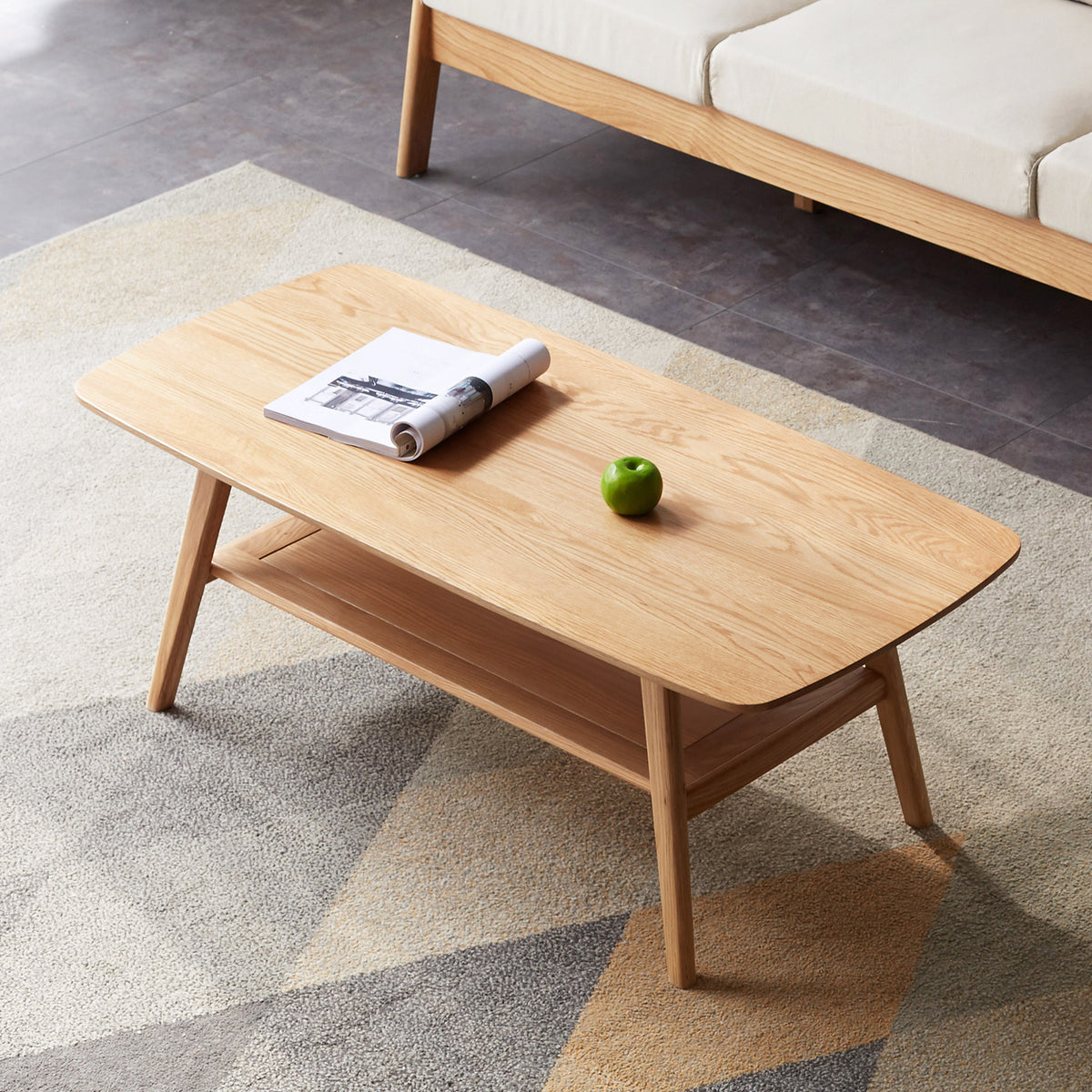 Natural oak coffee table with storage shelf from Anthony & Home's Atelier Collection, showcasing a stylish and functional design.