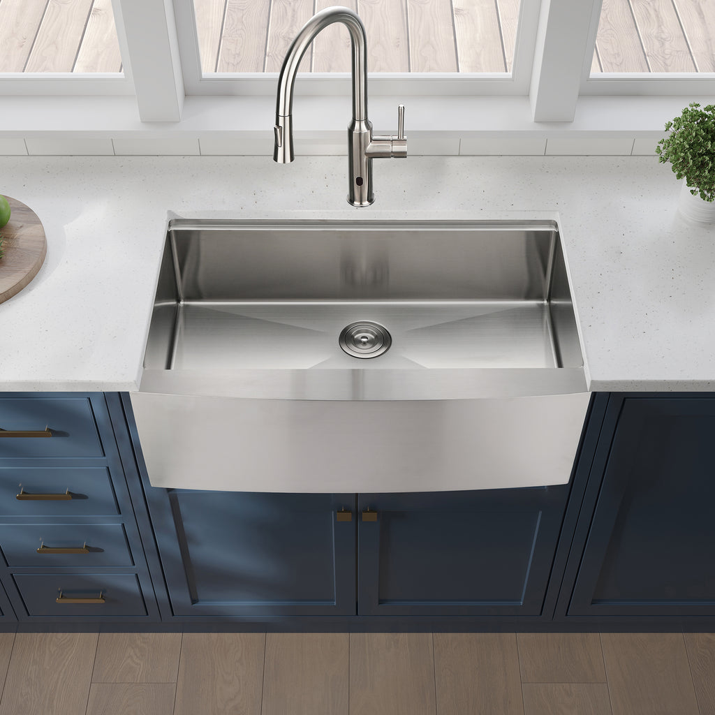 Stainless steel farmhouse apron kitchen sink workstation with deep basin and modern design by Anthony & Home.