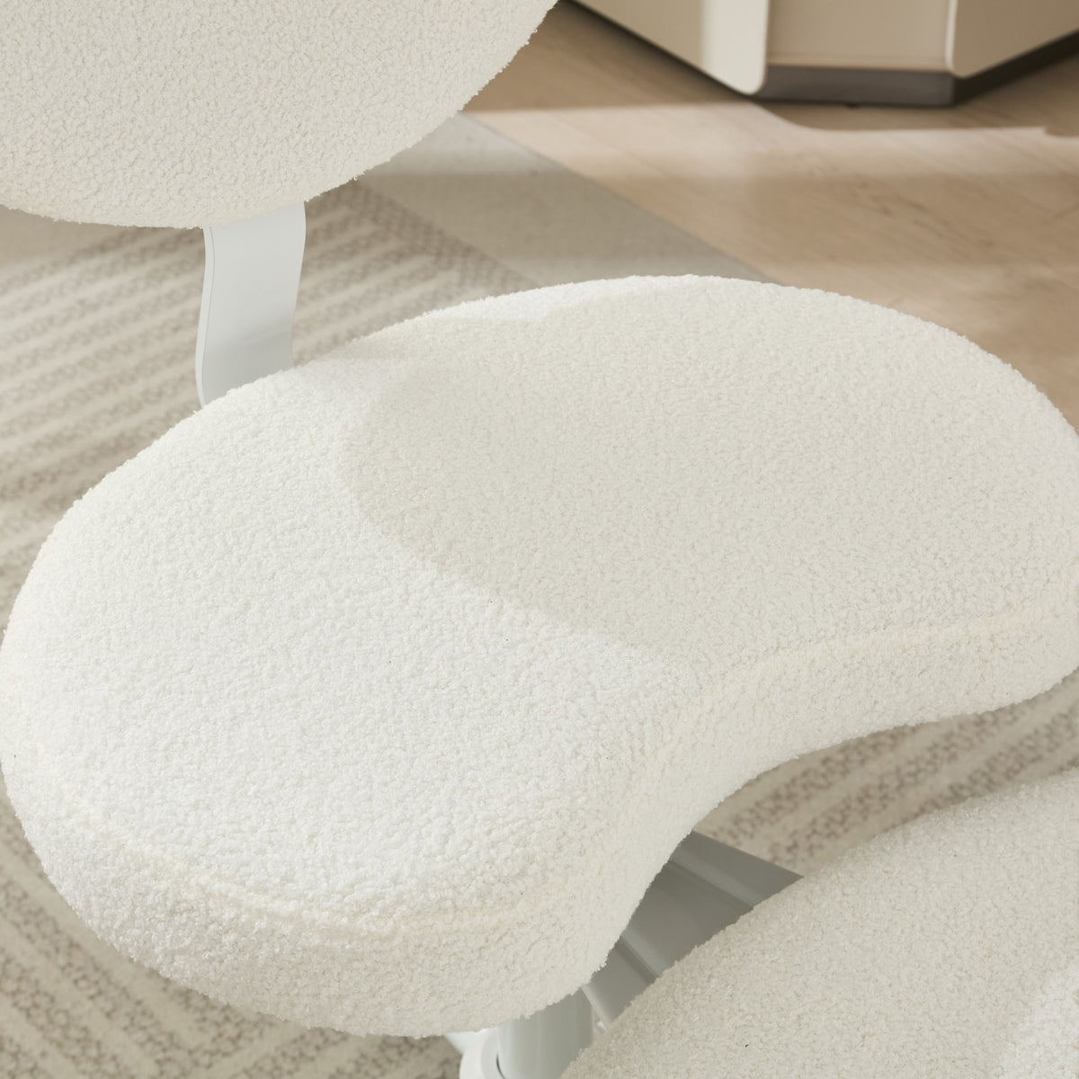 Ivory cross-legged meditation chair with wheels by Anthony & Home, designed for comfortable seated meditation practice.