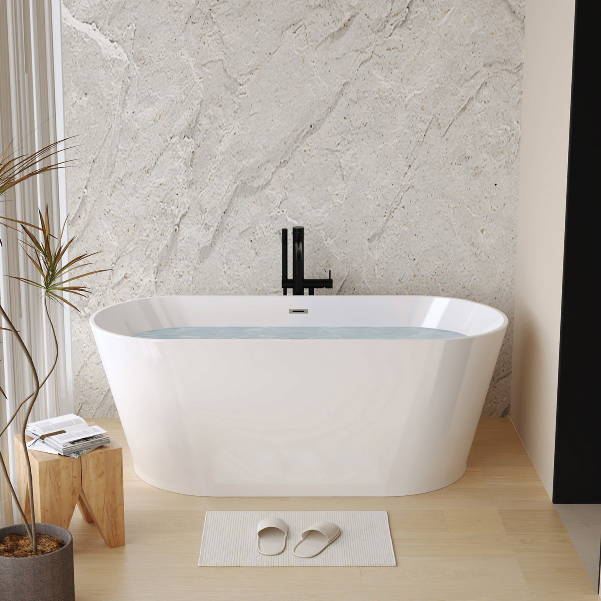 Glossy white acrylic freestanding soaking bathtub with ergonomic design by Anthony & Home.