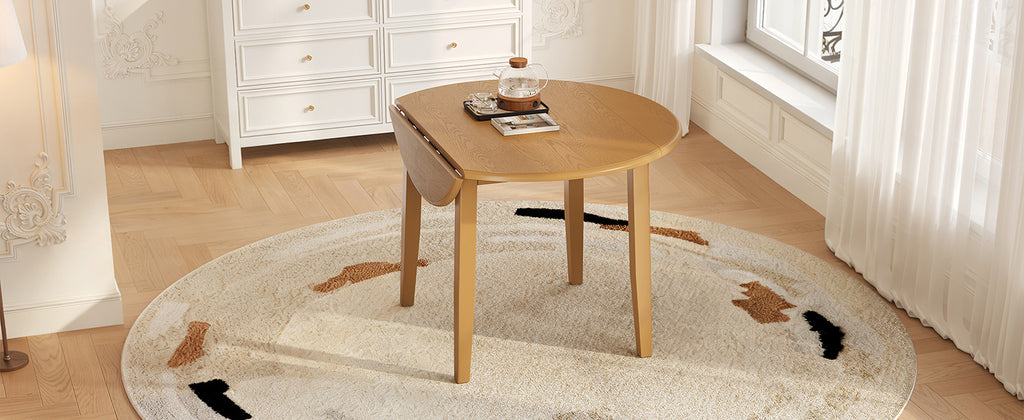 Extendable round dining table by Anthony & Home, made of solid wood, featuring a versatile design for dining and gatherings.
