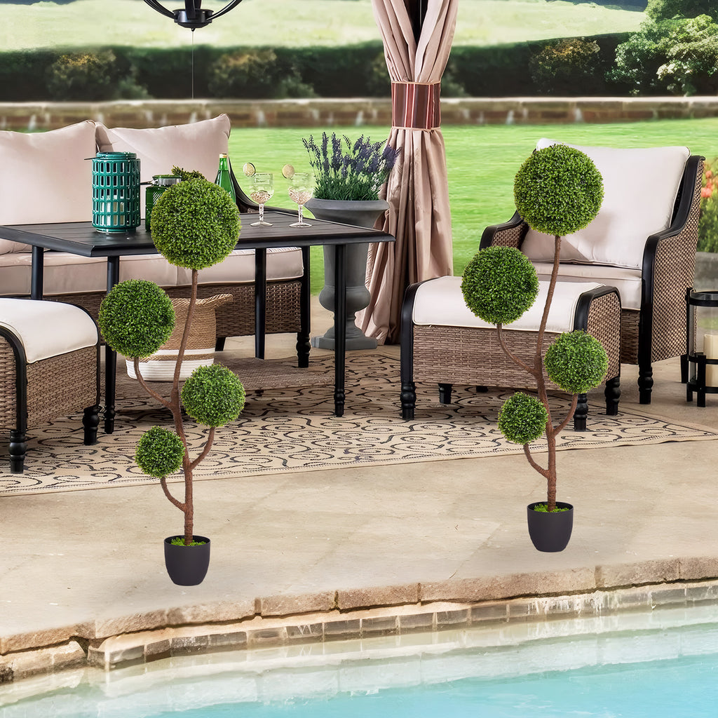 Boxwood topiary tree with triple ball shape, 59 inches tall, from Anthony & Home's Atelier collection, displayed in a garden setting