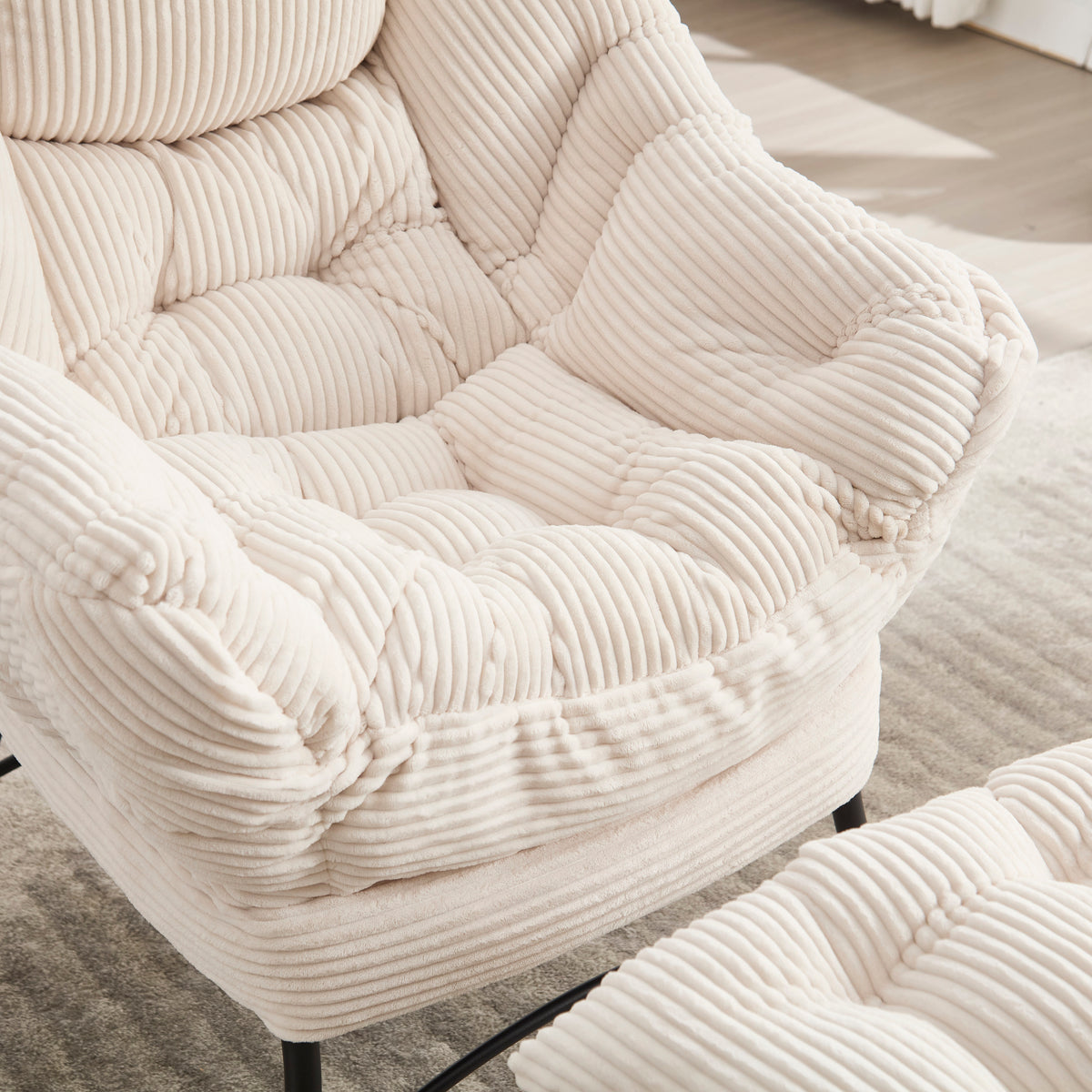 Ivory upholstered lounge chair with matching ottoman and side pocket, modern reading nook accent by Anthony & Home