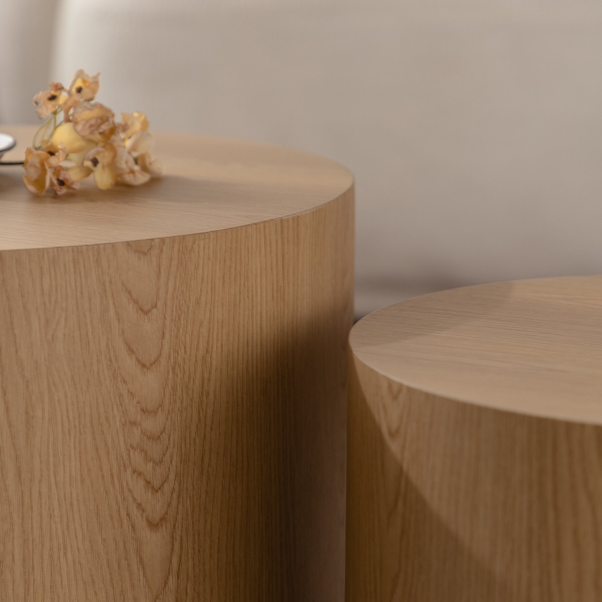 Set of nesting round coffee tables by Anthony & Home, featuring sleek wooden surfaces and modern design for living room decor.