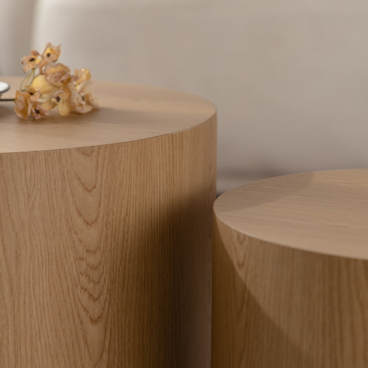 Set of nesting round coffee tables by Anthony & Home, featuring sleek wooden surfaces and modern design for living room decor.