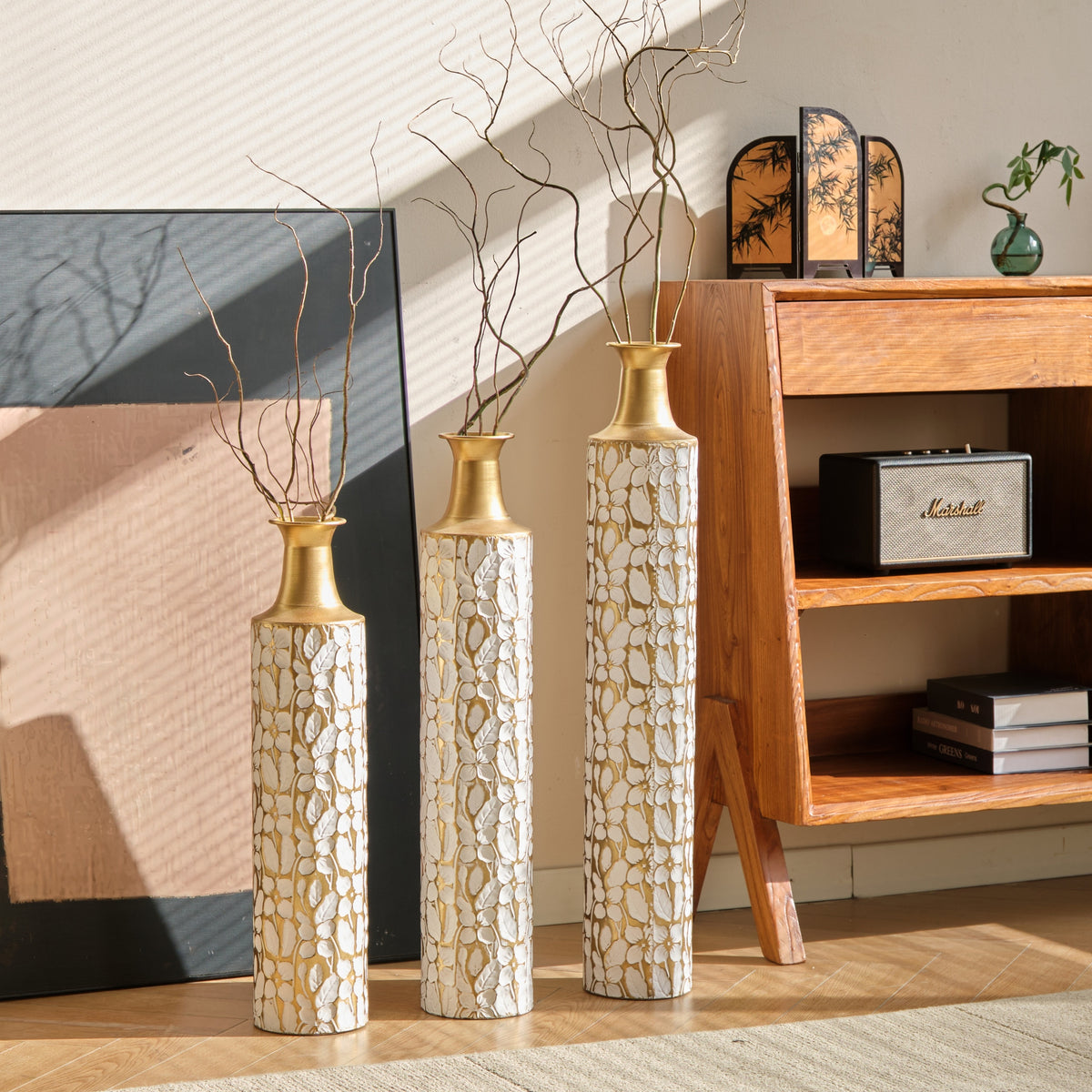 Heritage Collection floor vase trio by Anthony & Home featuring elegant ceramic vases with intricate patterns on a neutral background.