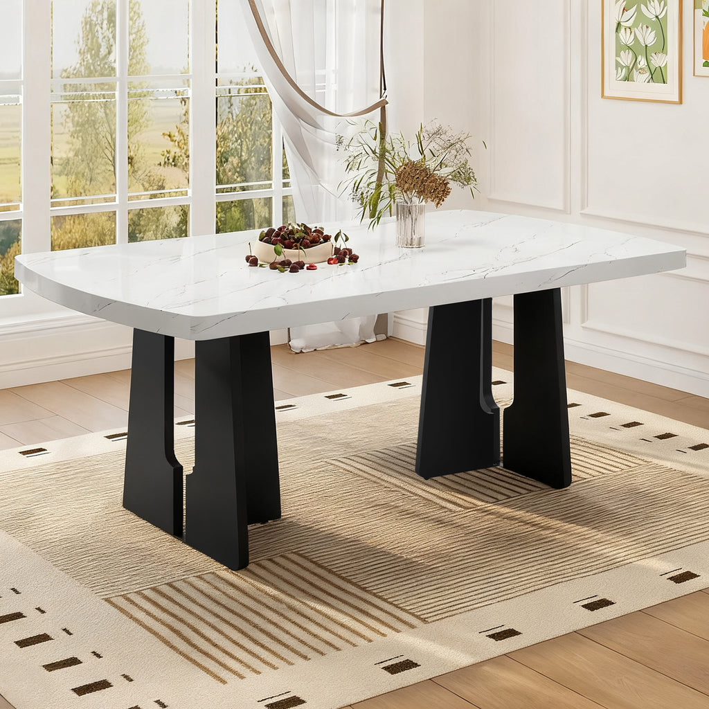 Black and white faux marble dining table with geometric legs by Anthony & Home, showcasing a modern, stylish design.