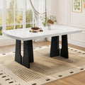 Black and white faux marble dining table with geometric legs by Anthony & Home, showcasing a modern, stylish design.