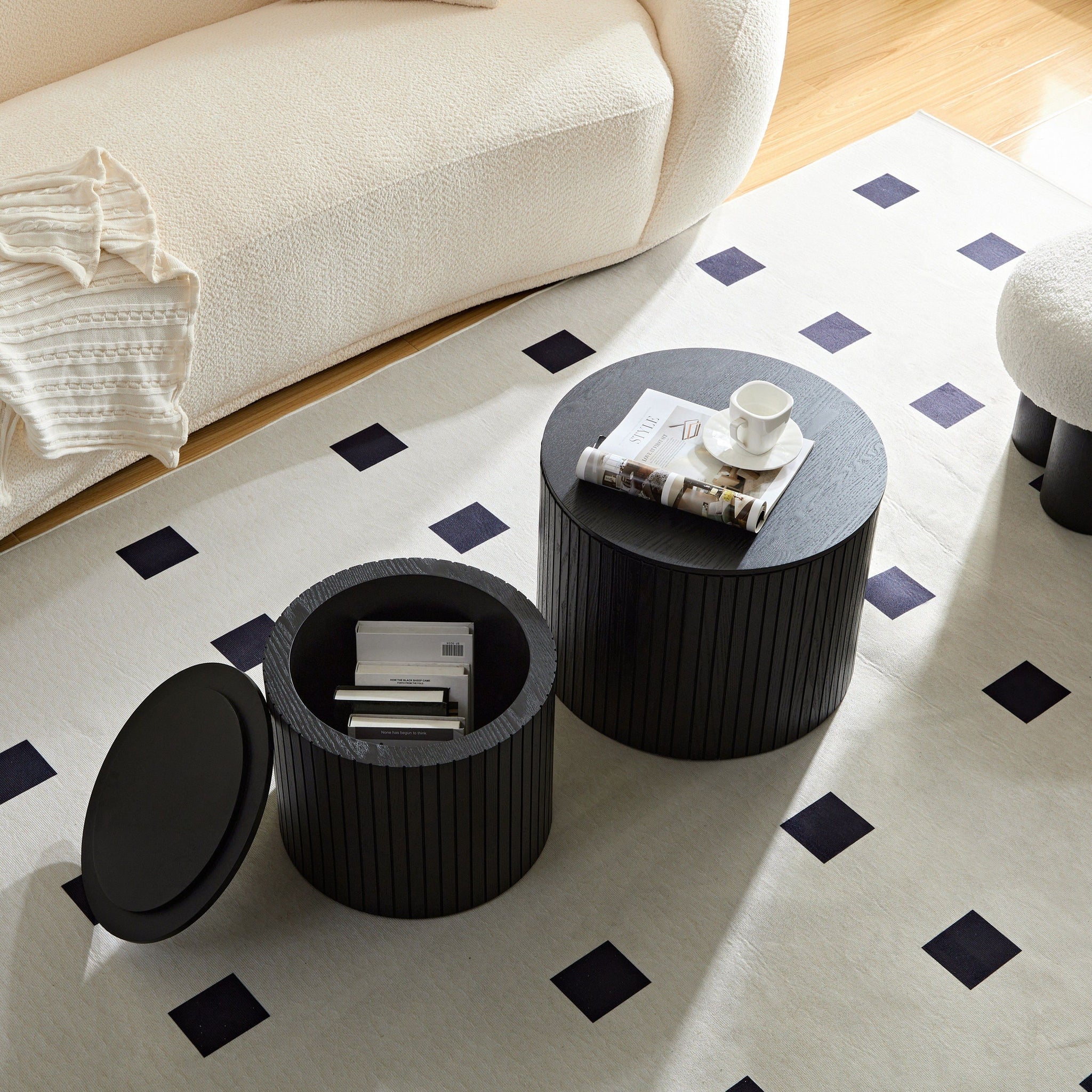 Pair of walnut veneer nesting coffee tables in black with sleek, modern design by Anthony & Home.
