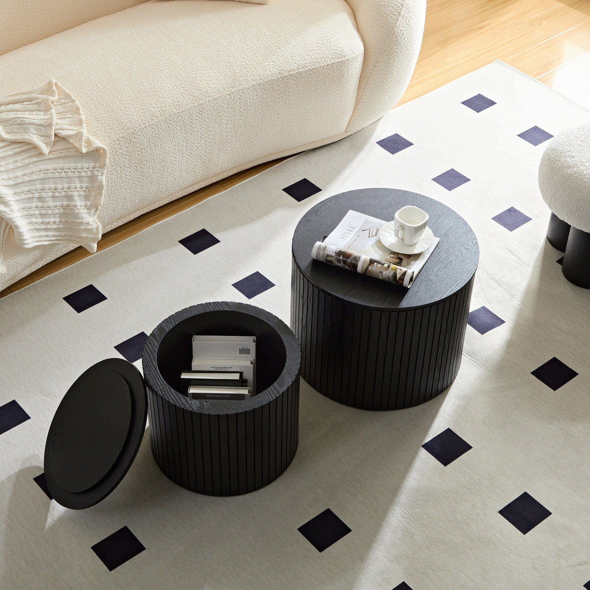Pair of walnut veneer nesting coffee tables in black with sleek, modern design by Anthony & Home.