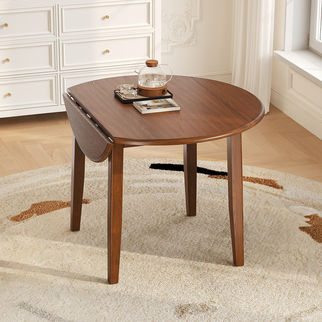 Anthony & Home Atelier Walnut Extendable Round Dining Table with 2-4 seating, showcasing polished wood surface and extendable design.