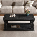 Weathered black farmhouse coffee table with heavy plank top, baluster legs, and storage shelf from Anthony & Home's Atelier Collection.