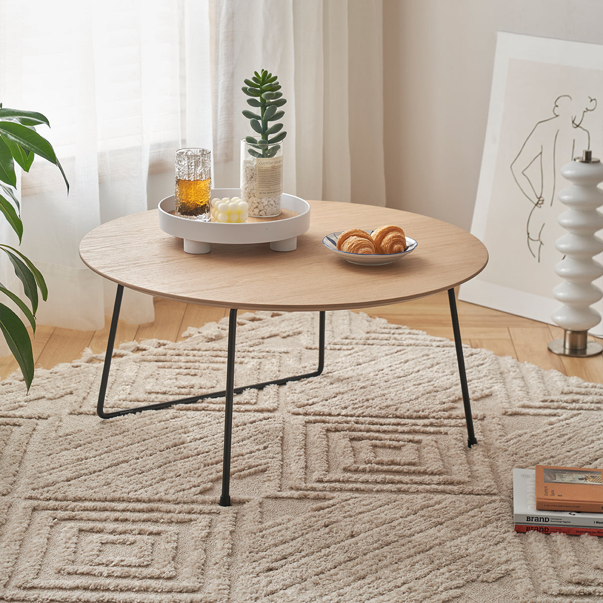 Marble-top round coffee table by Anthony & Home, minimalist American design, ideal for small apartments, with sleek modern style.